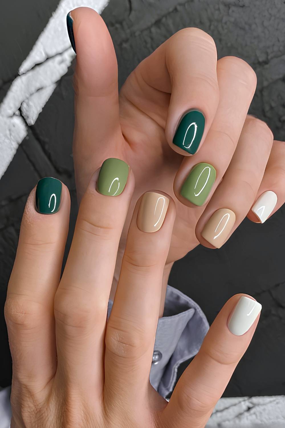 Skittle manicure in mixed green shades from mint to emerald
