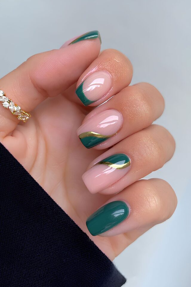 Emerald with Gold-Trimmed French: emerald French tips edged in gold on sheer pink short square nails