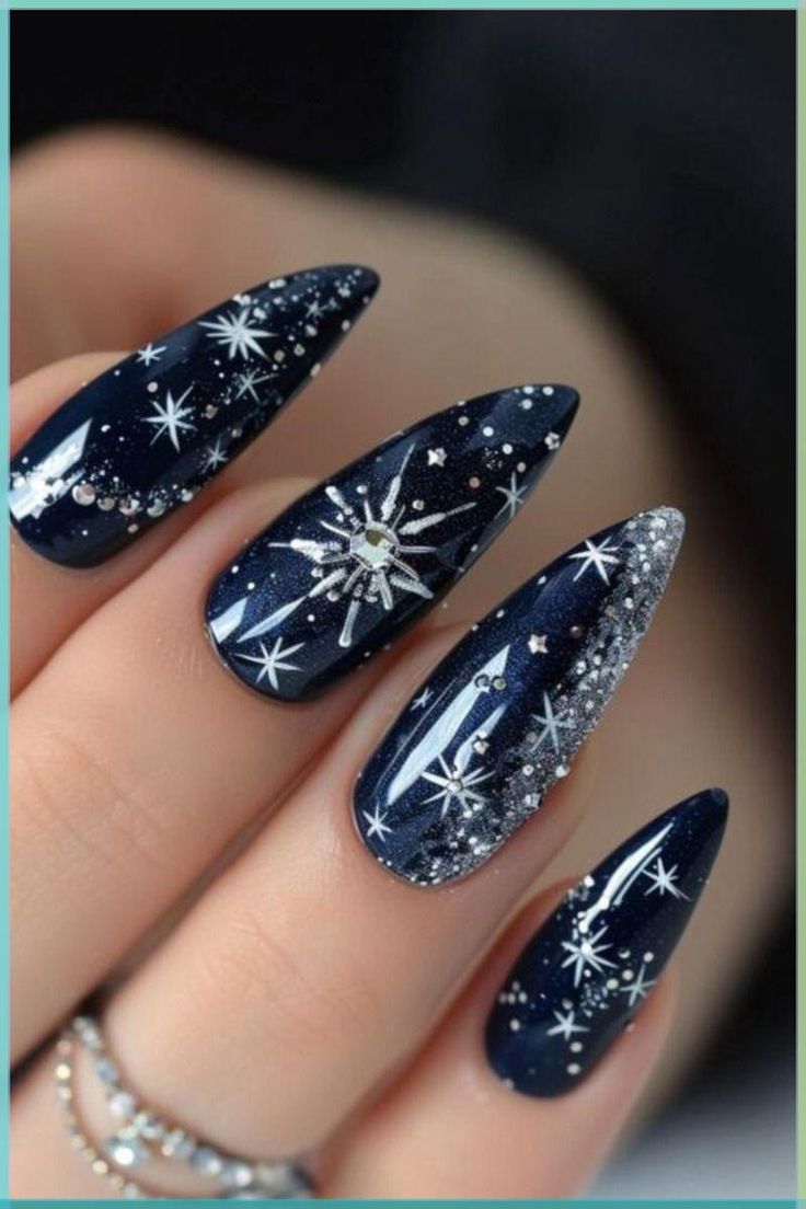Midnight Navy with Silver Starbursts: navy stiletto nails with silver starbursts and rhinestones
