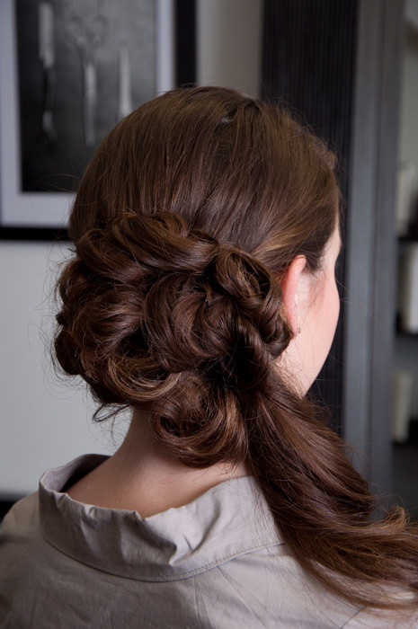 Woman with a side chignon updo hairstyle