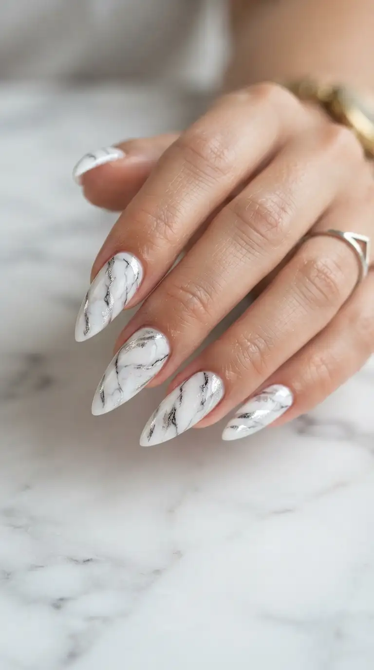 Stiletto nails with white and silver marble design