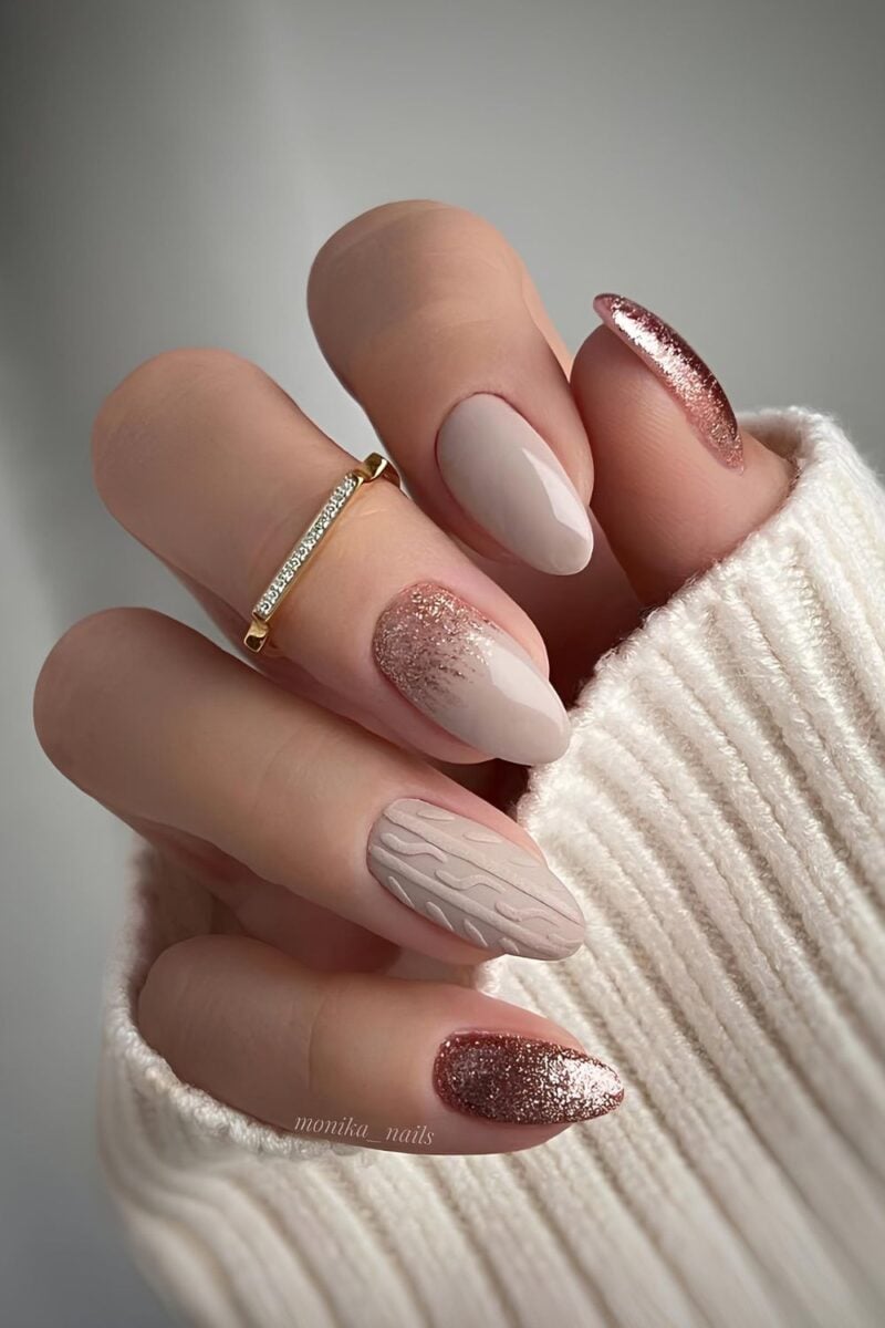 Short oval taupe nails with cable-knit sweater pattern art
