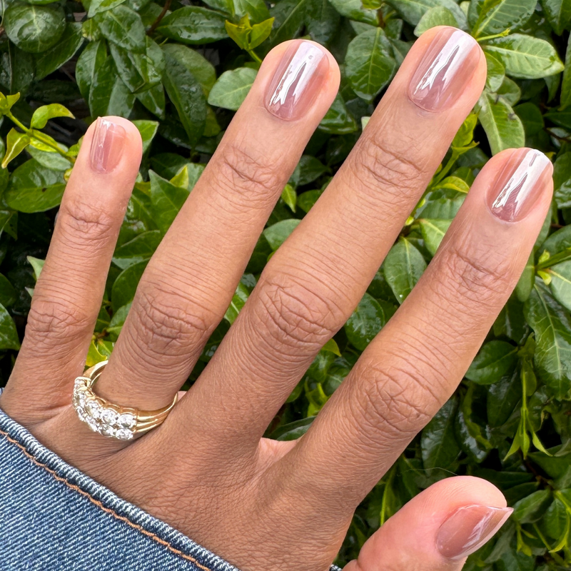 Short oval press-on nails in taupe jelly chrome