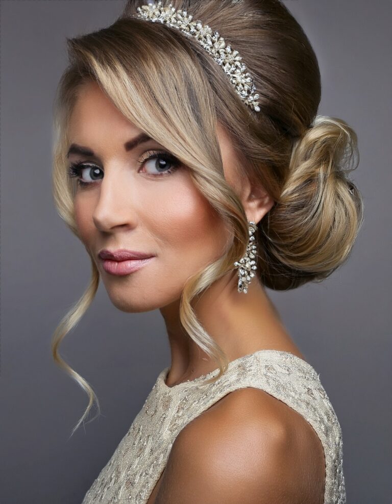 Blonde woman with an asymmetrical updo wearing a sparkling crystal headband