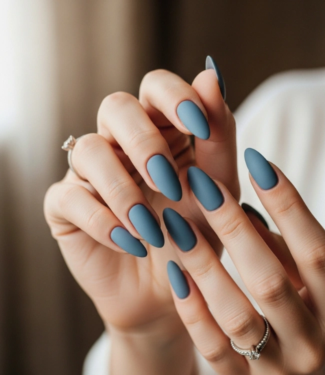 Dusty blue matte oval nails in medium length