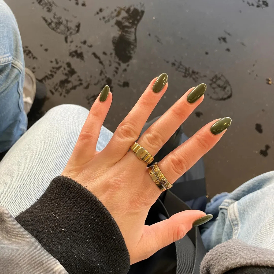 Medium almond nails in deep glossy jungle green