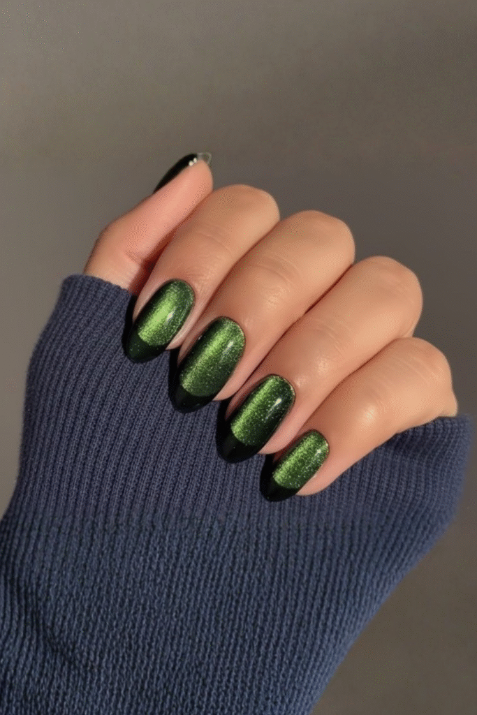 Medium oval nails in deep green magnetic cat-eye shimmer