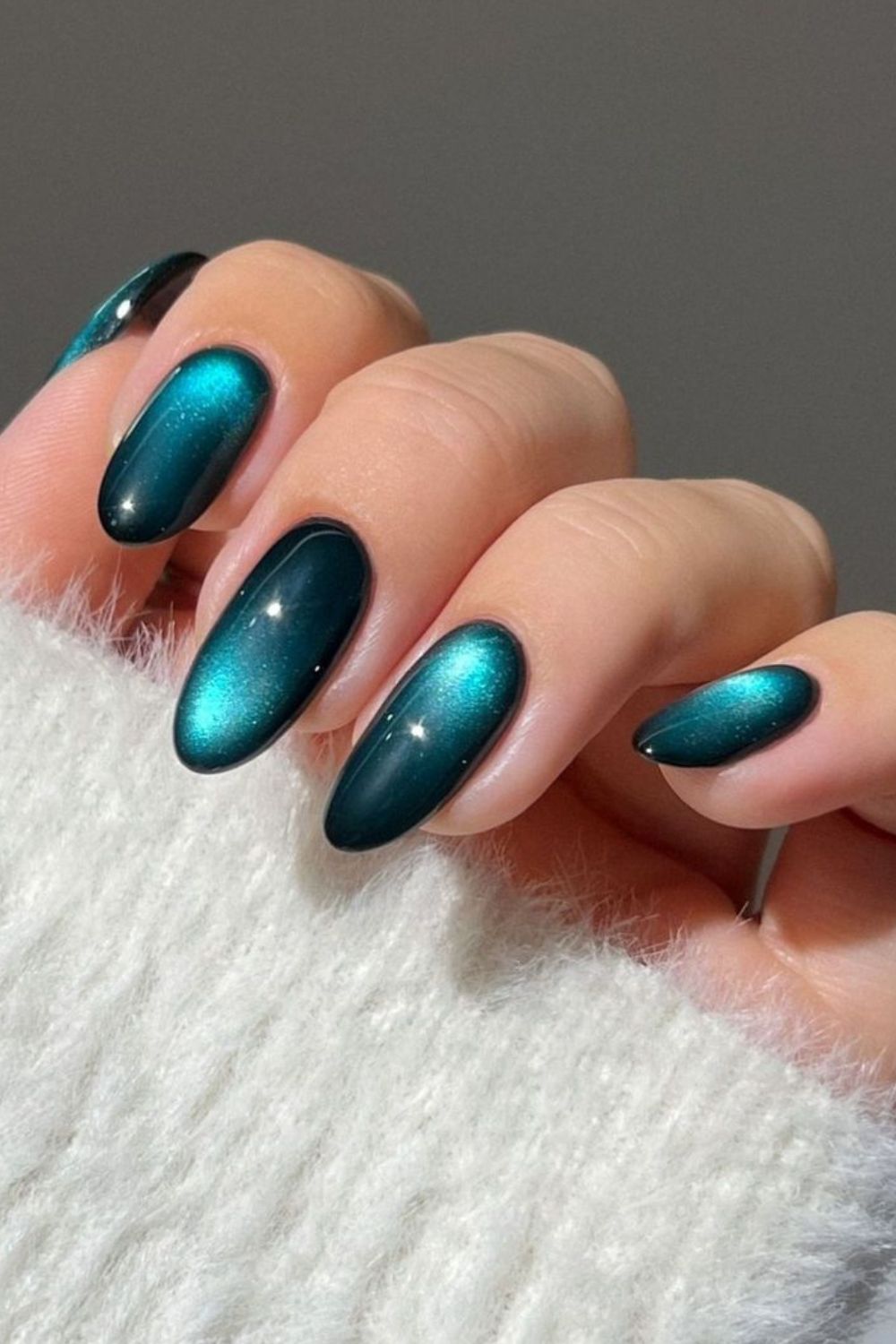 Deep ocean teal cat eye nails with velvet glow