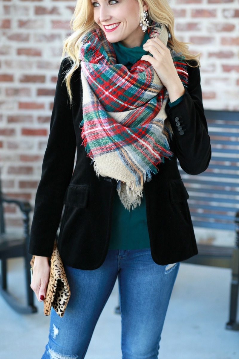 Red and green plaid blanket scarf over a black velvet blazer with jeans