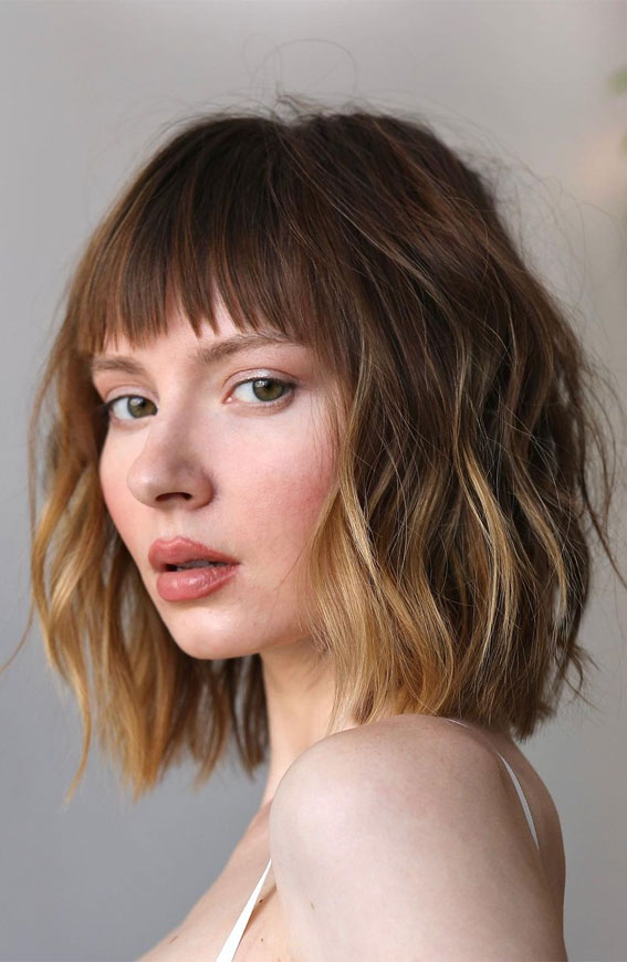 Wavy bob with choppy fringe in ash brown with lighter ends