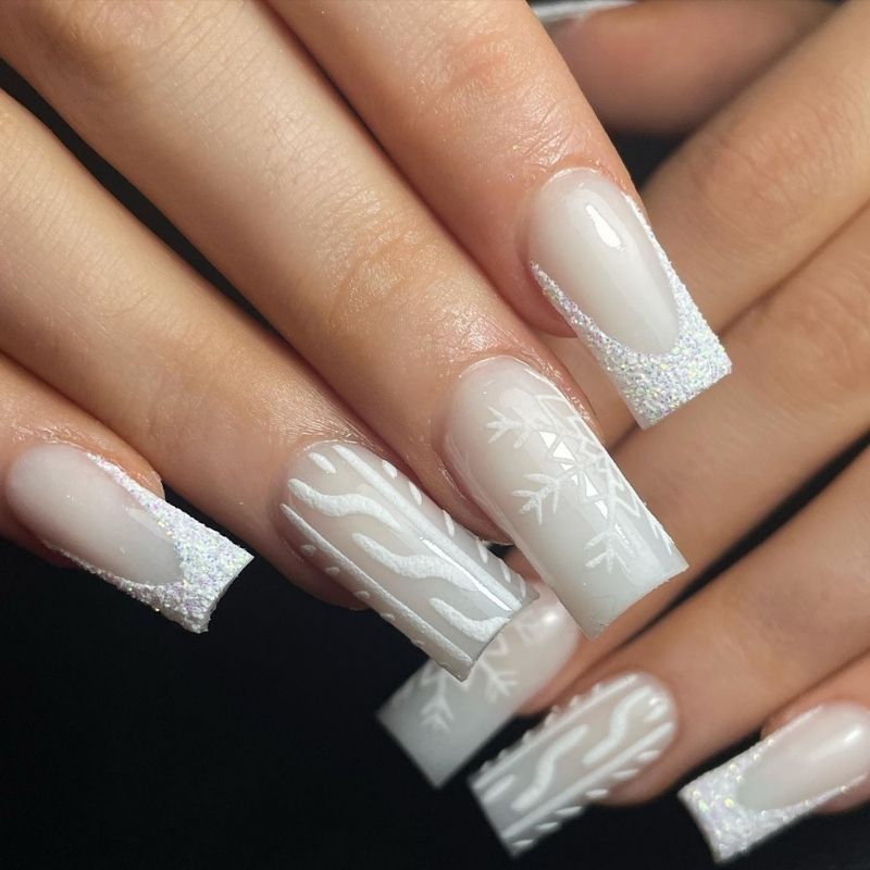 Long square frosty white nails with iridescent glitter French tips, snowflake art and cable-knit texture