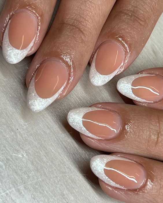 White French tip nails with sparkling glitter tips