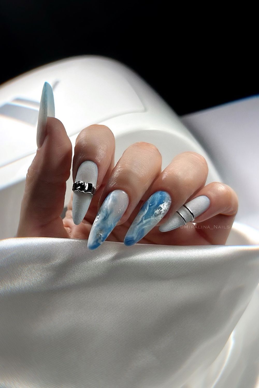 Icy blue marble effect gel nails for winter