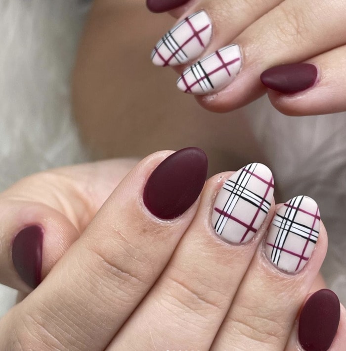 Matte burgundy nails with white tartan plaid accent nails