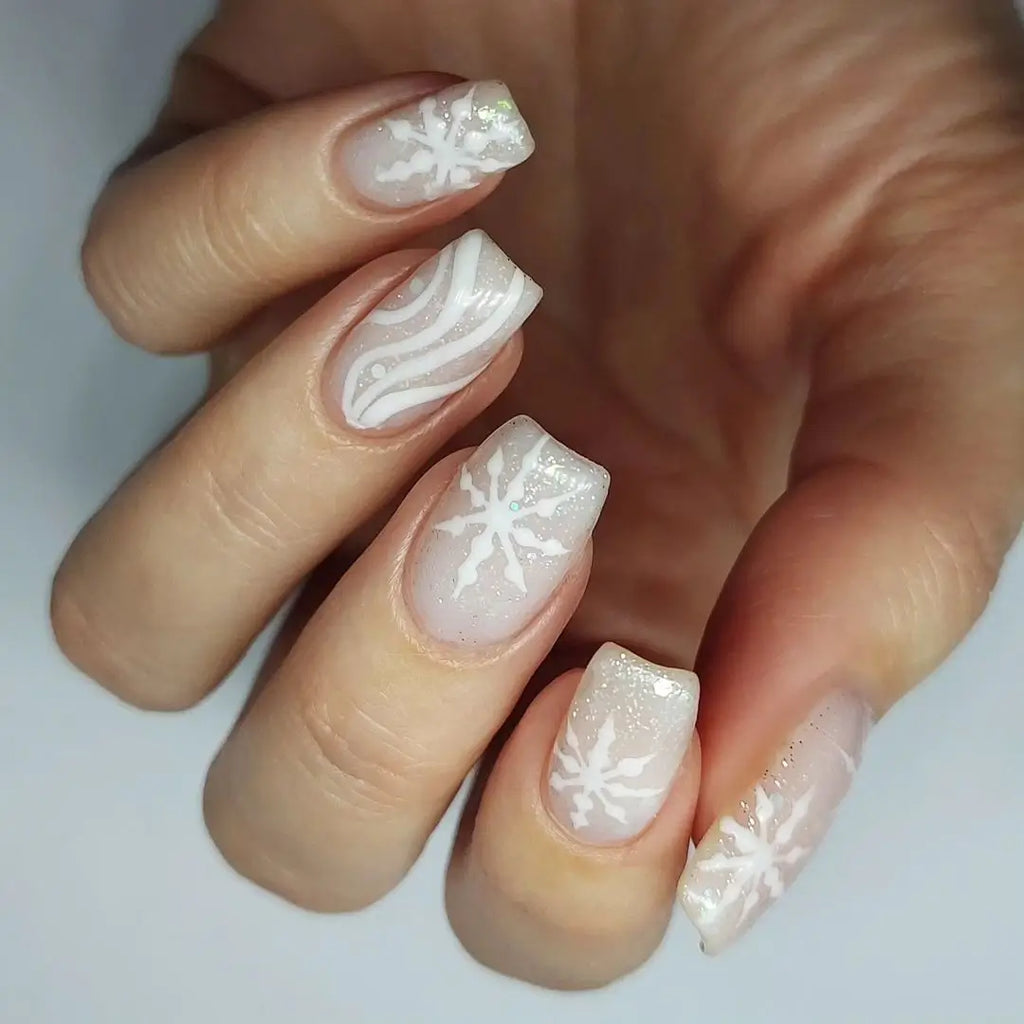 White winter manicure with a snowflake accent nail design