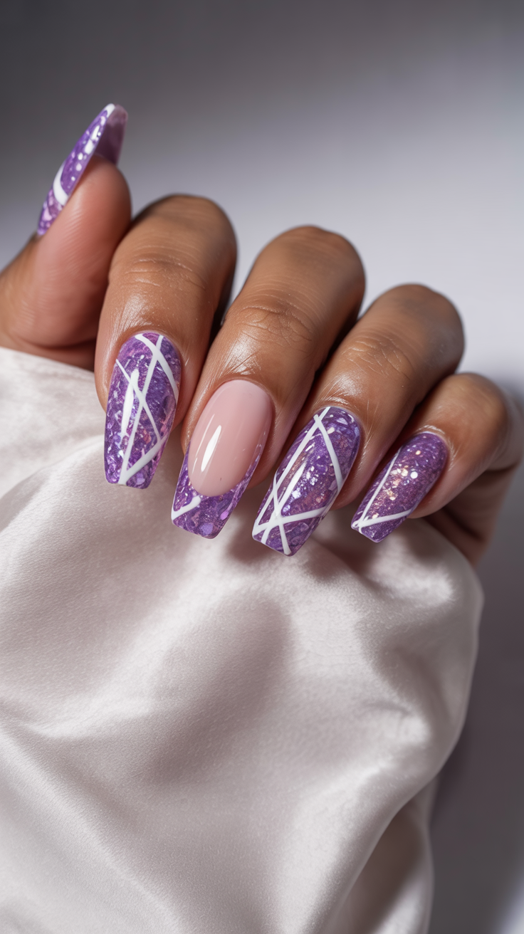 Medium almond nails in purple with white abstract frost-like line art