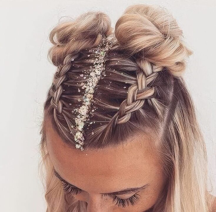 Double French braids into half-up space buns with glitter parting