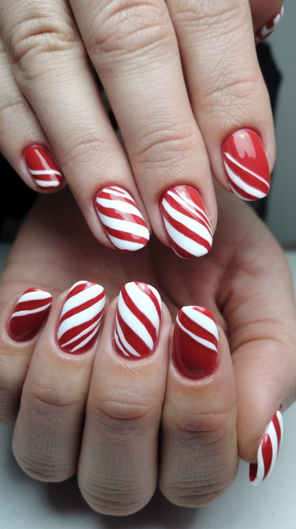 Short square nails with red and white candy cane stripes