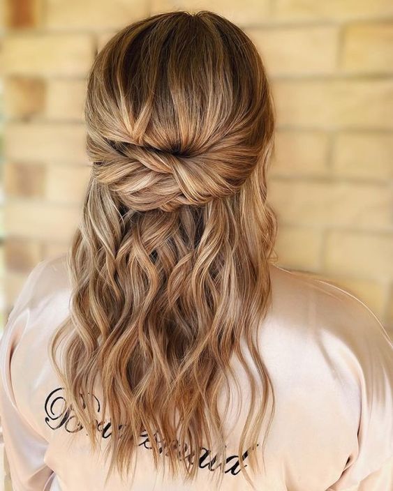 Twisted crown half-up with face-framing tendrils