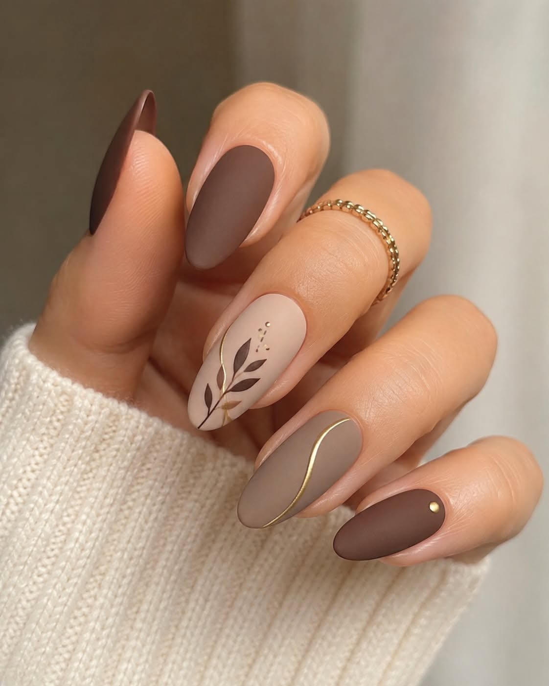 Matte taupe nails with gold dot accent detail