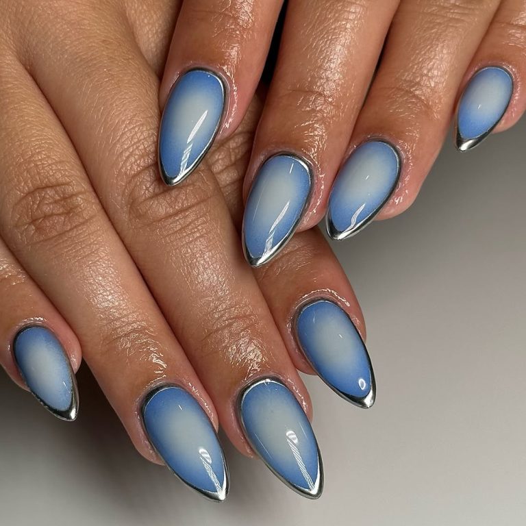 Almond nails with airbrushed blue aura and silver chrome outline
