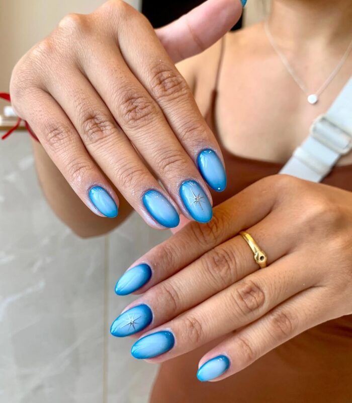 Blue aura effect nails with icy center glow