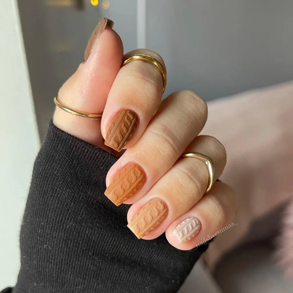 Matte cable-knit nails in milk chocolate, caramel, and cream tones