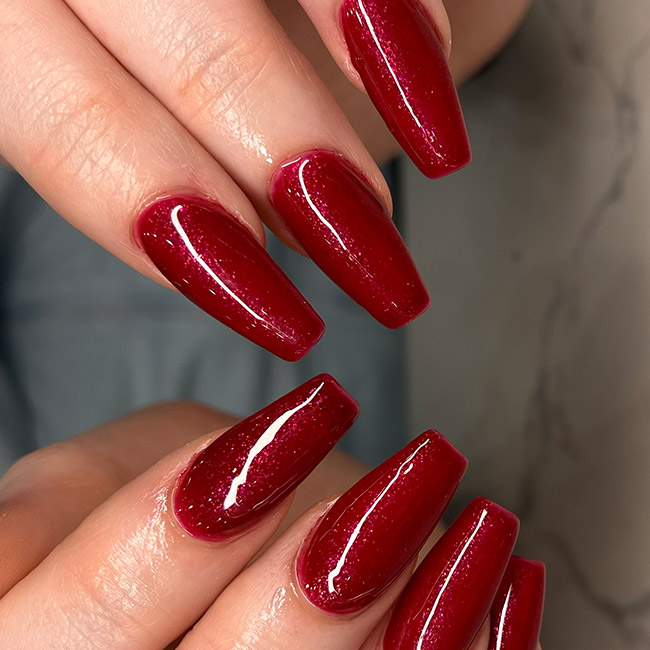 Coffin nails with a cherry red velvet magnetic shimmer finish