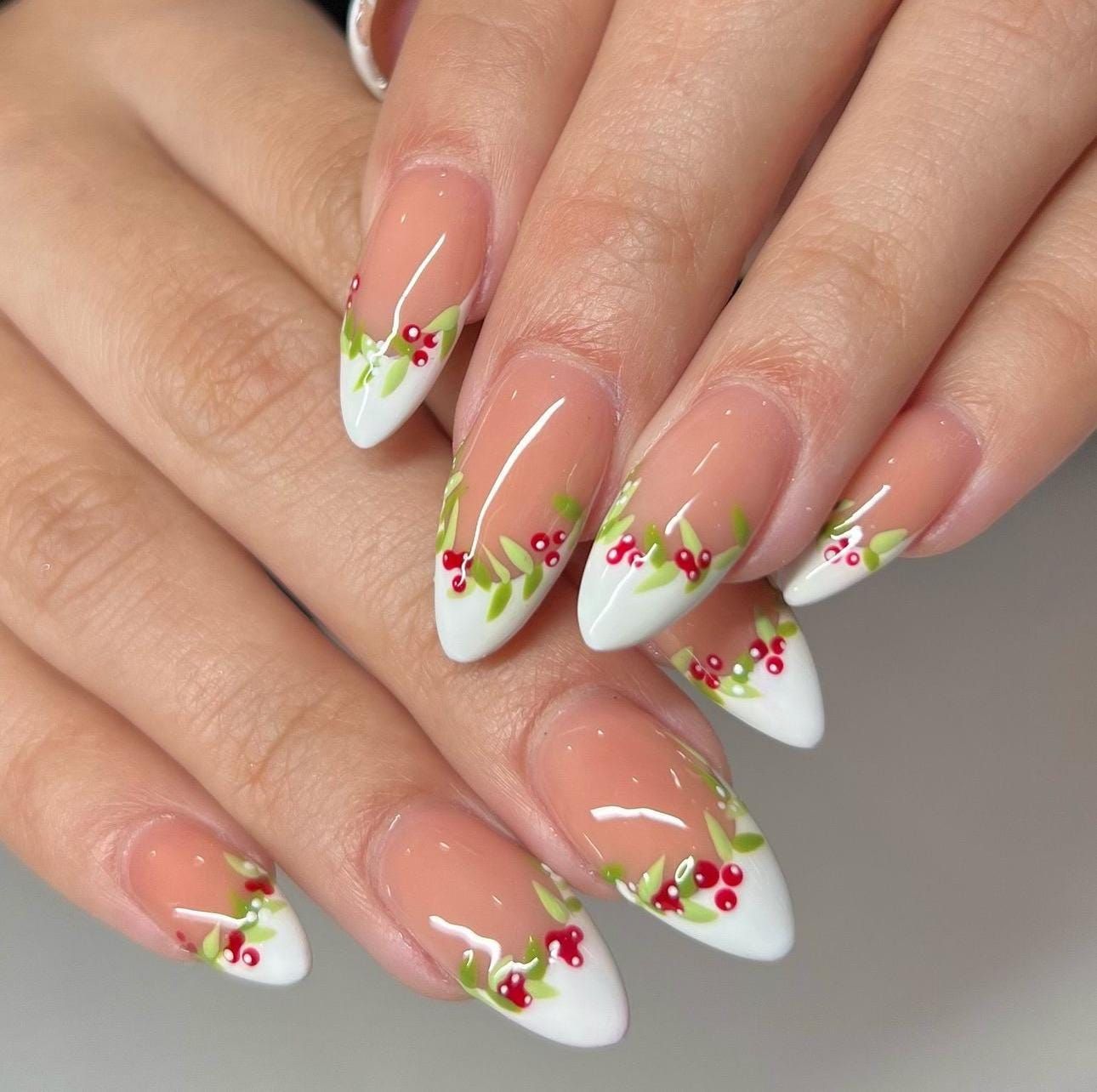 Matte pink nails with evergreen branches