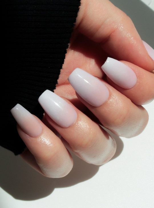 Baby boomer white-to-pink ombre on long coffin nails