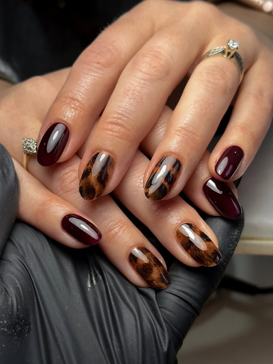 Black cherry nails mixed with tortoiseshell accent nails