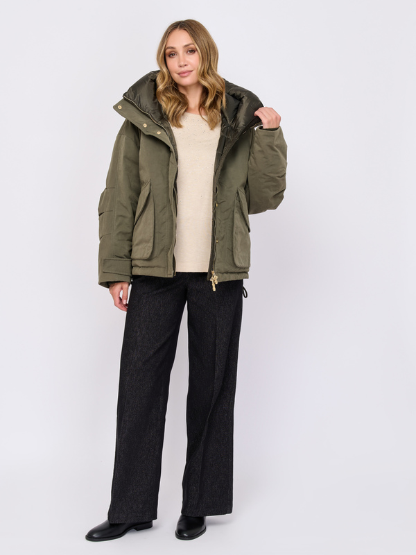 Olive parka with a cream sweater