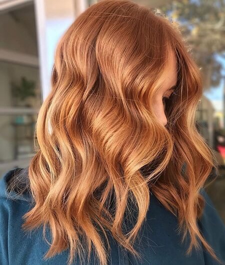 Golden copper shoulder-length hair with warm shine