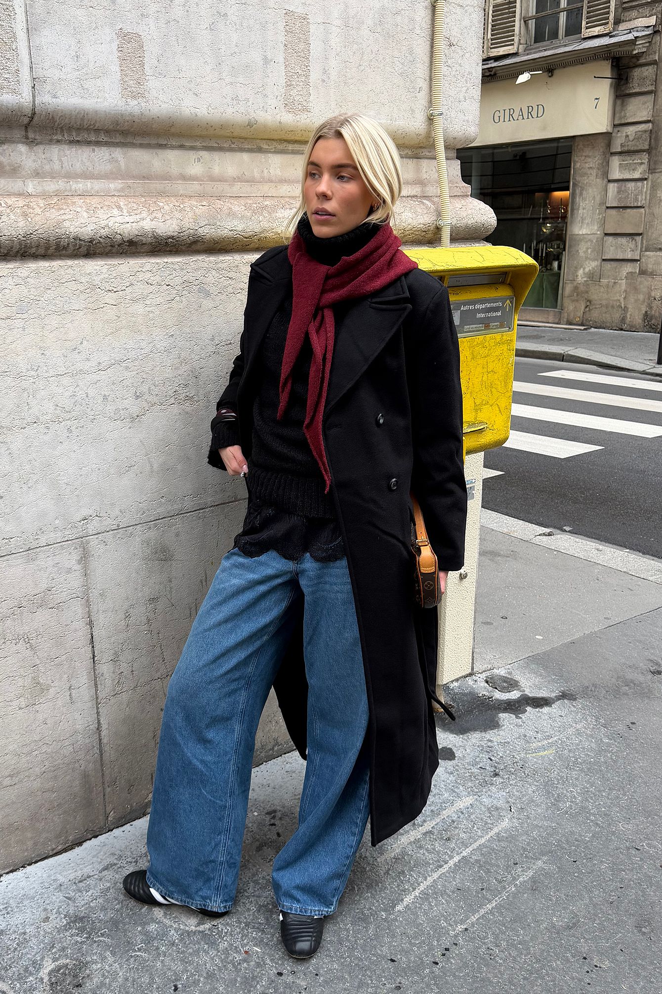 Black wool-blend coat product photo on a model