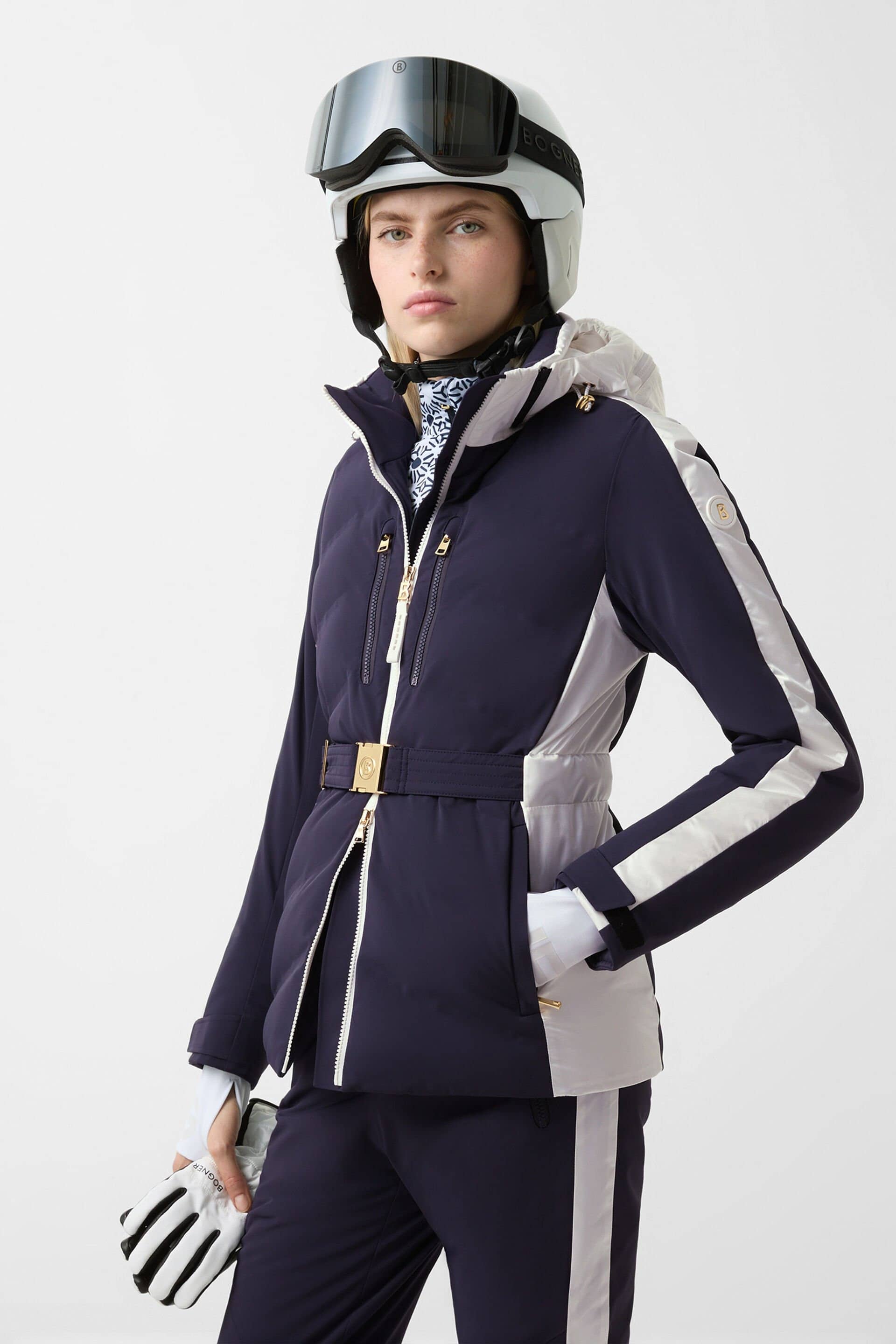 Product photo of a black quilted ski jacket with a fur-trimmed hood