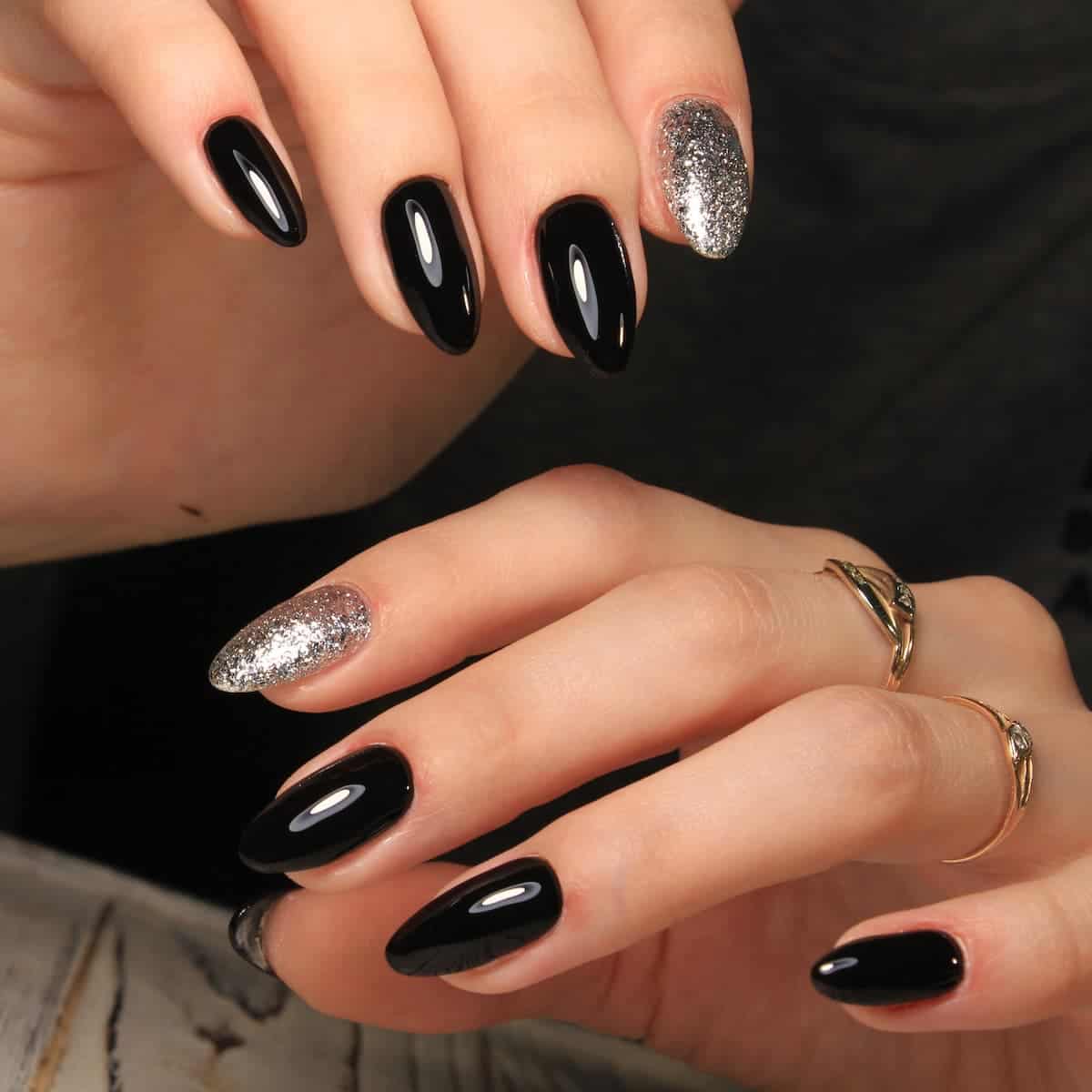 Starry Black: black polish with silver glitter accent nails