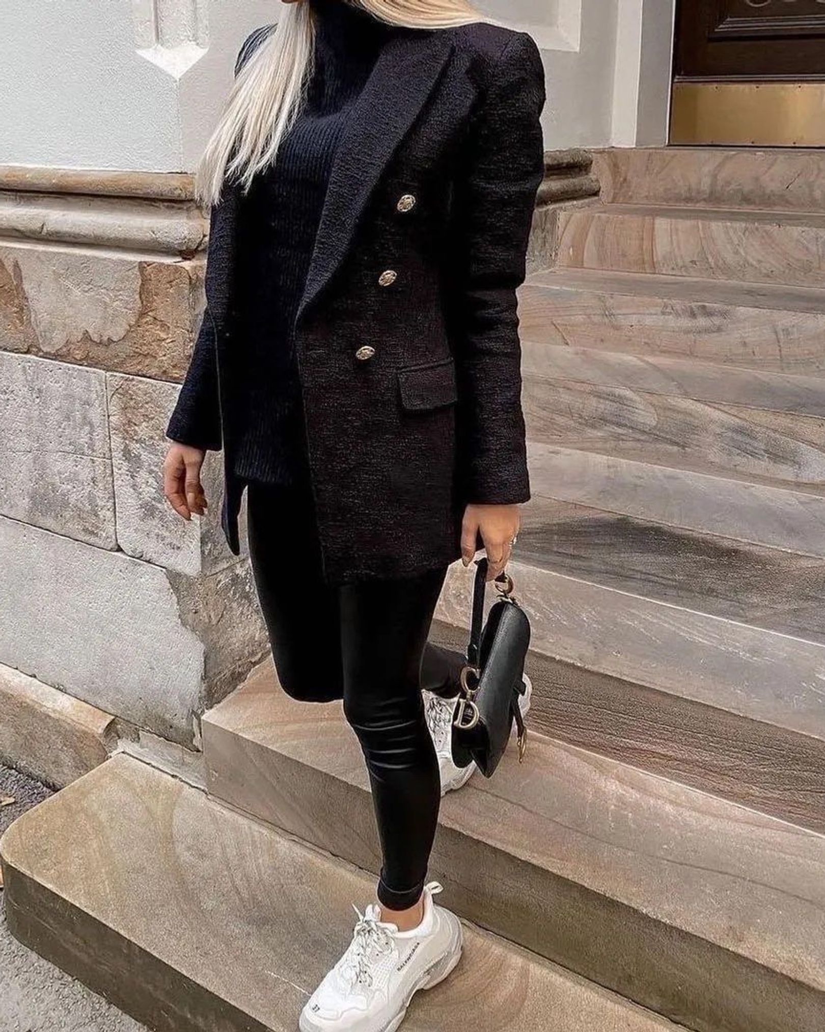 Black tweed blazer with black turtleneck, faux-leather leggings, white sneakers and black bag