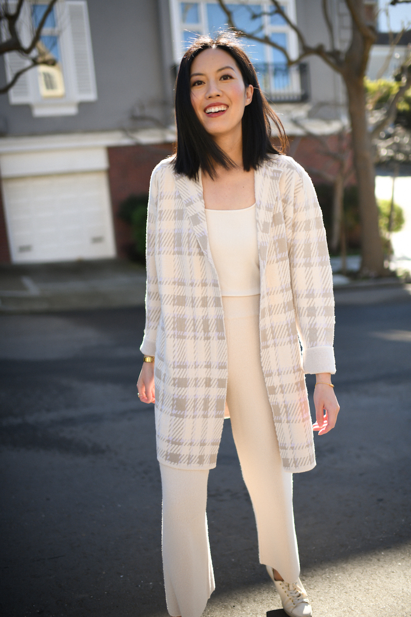Longline cardigan layered over a sweater and button-up shirt for office winter style