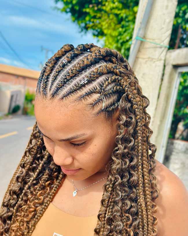 Honey-blonde fulani braids with curly loose ends