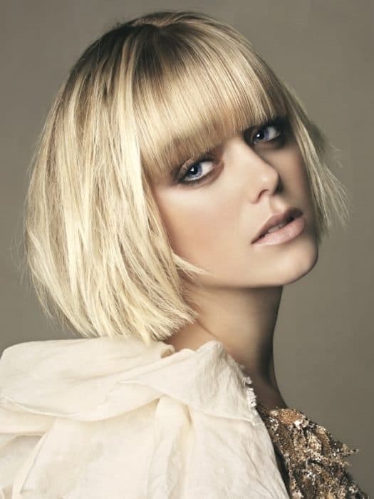 Golden blonde chin-length bob with full bangs