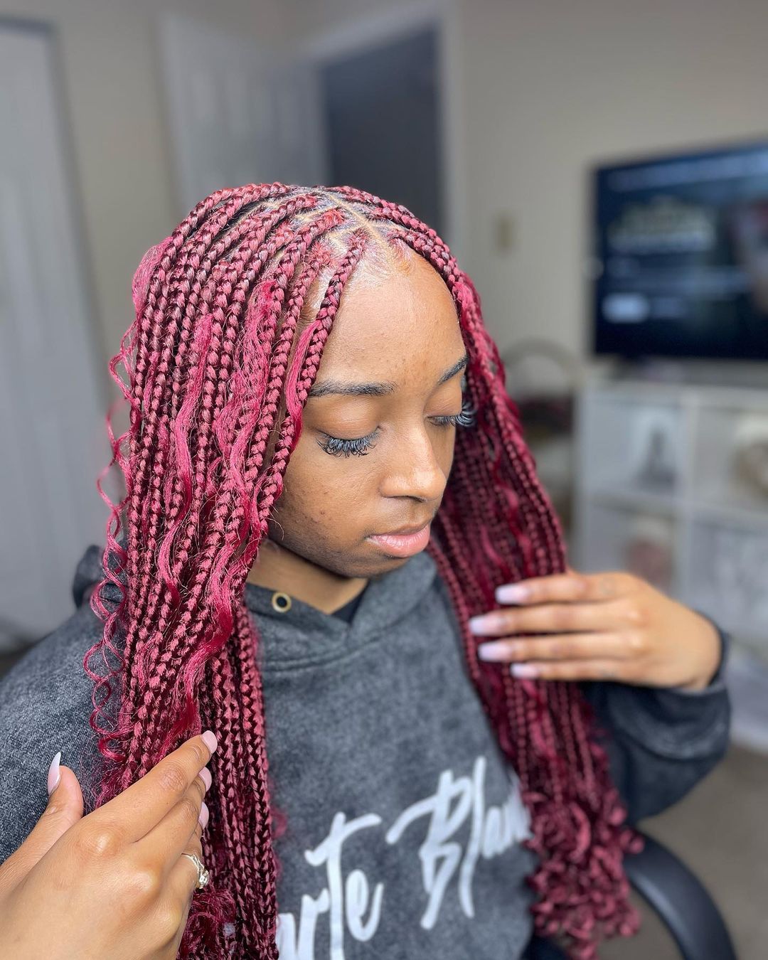 Burgundy boho box braids with curly ends