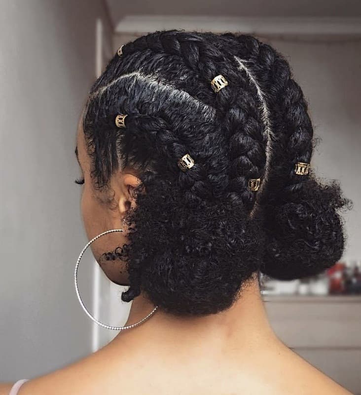 Braided space buns with curved cornrow parts