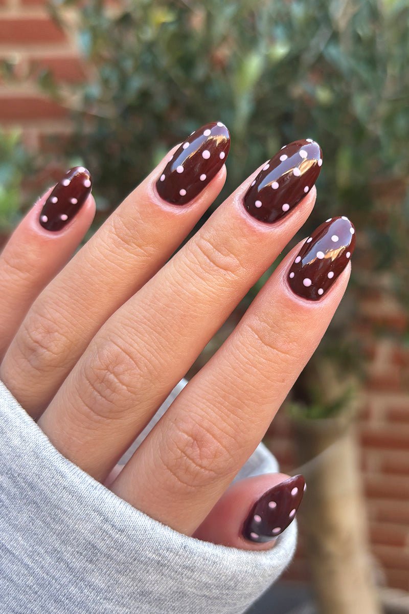Brown nails with white polka dots