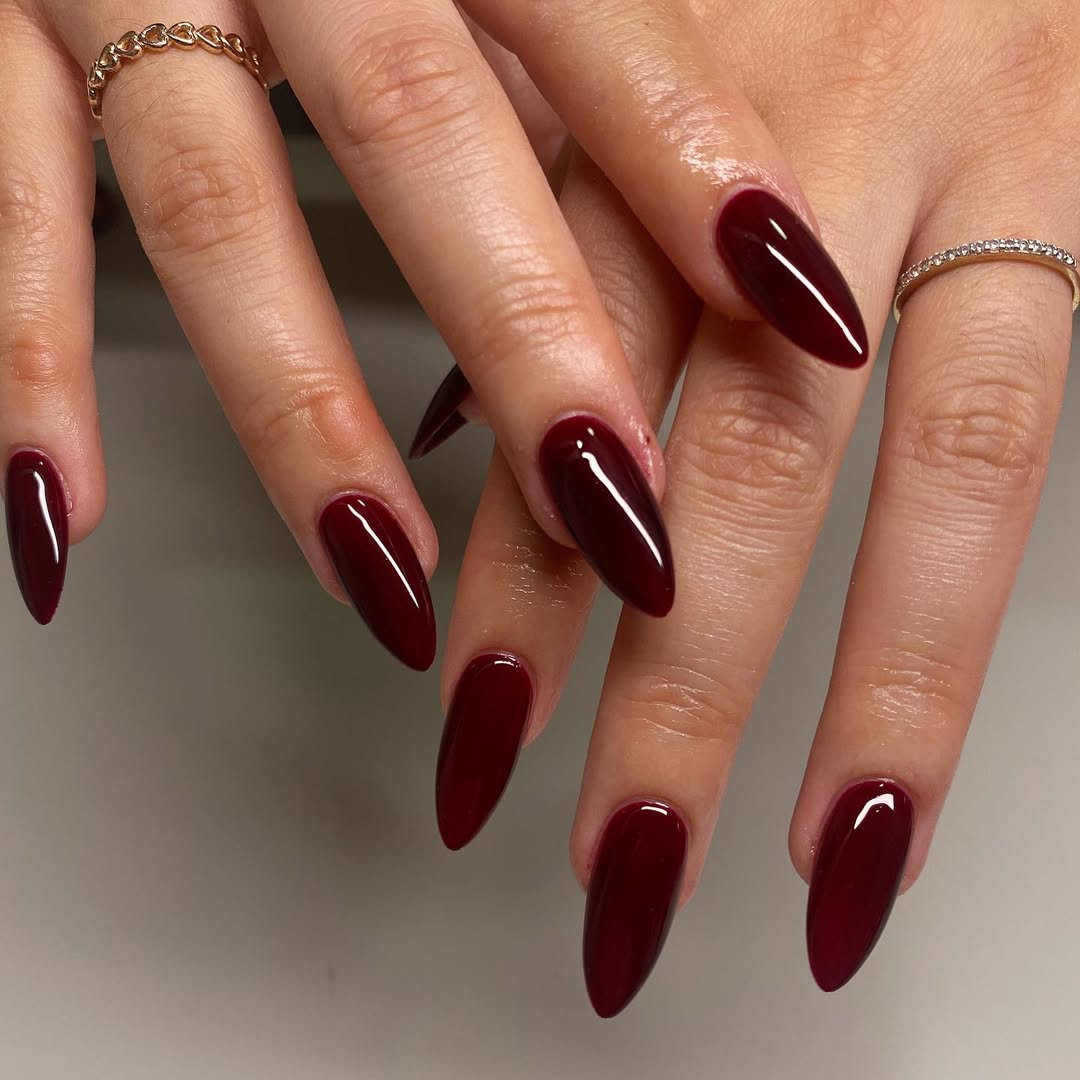 Burgundy stiletto nails with glossy finish