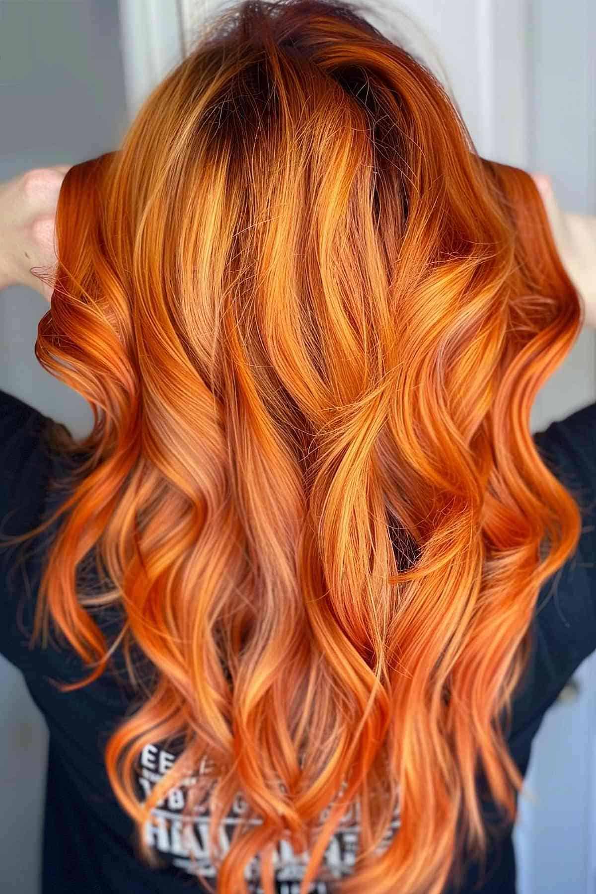 Burnt orange copper hair styled in soft waves