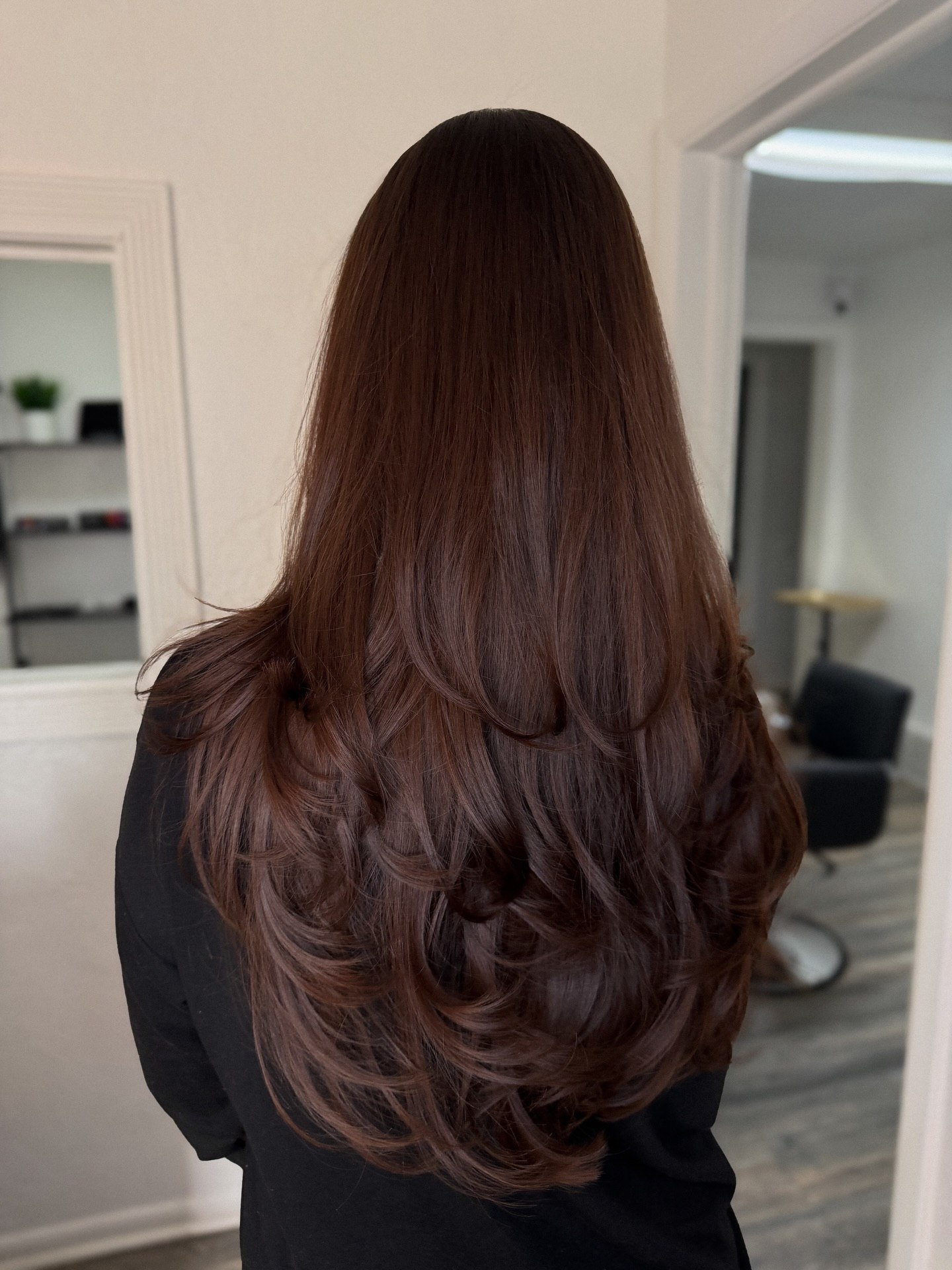 Long espresso brown hair with butterfly layers and soft movement
