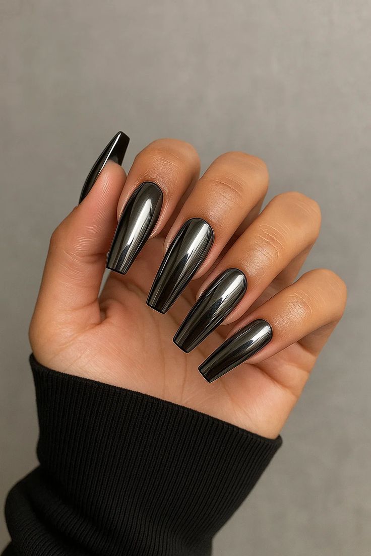 Dark black chrome nails with a deep mirrored smoky finish