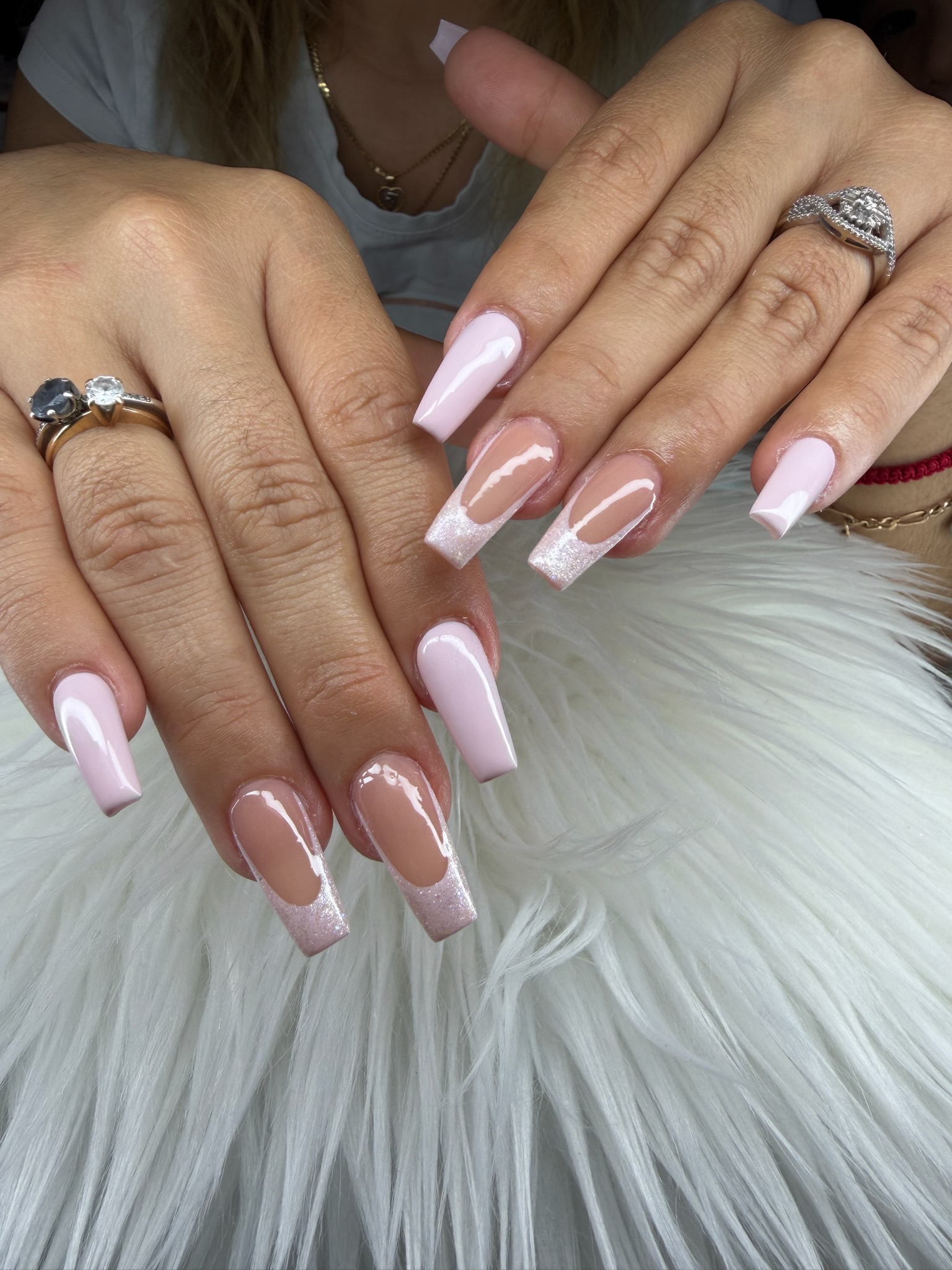 Long pink nails with glitter French tips