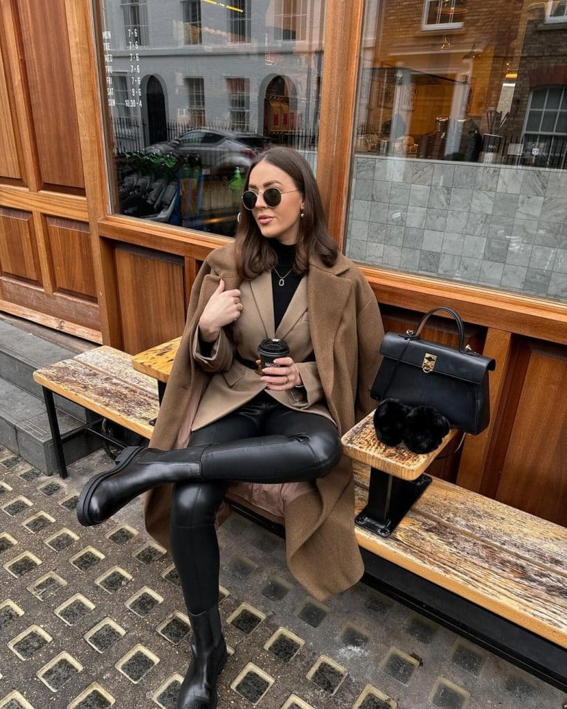 Woman in a belted wool robe coat with chelsea boots