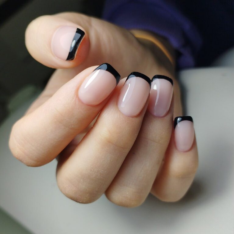 Short oval nails with jet black French tips